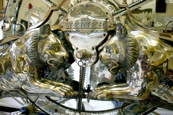Lion detail on side of Weiner parade carriage at FASNY Museum of Firefighting. Hudson, NY.