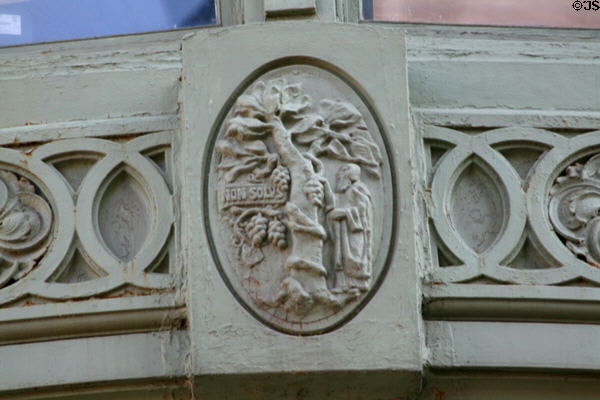 Cast iron panel with Elsevier's Non Solus printer's mark on Old New York Evening Post Building. New York, NY.