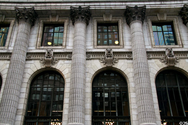 Lions over arched windows of New York Public Library. New York, NY.