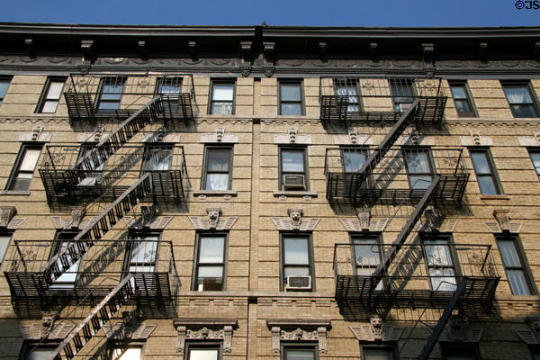Heritage building with lions & fire escapes (75-79 Orchard St.). New York, NY.