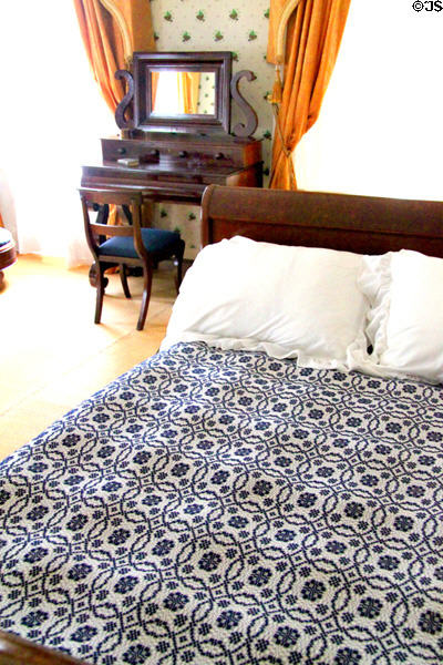 Vanity table with mirror & sleigh bed with blue coverlet in upstairs bedroom at Lindenwald. Kinderhook, NY.