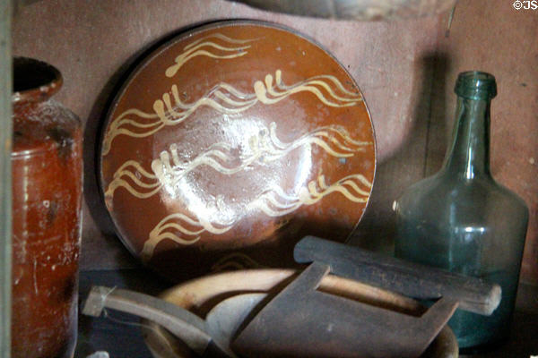Redware pottery & glass bottle at Thomas Halsey Homestead. South Hampton, NY.
