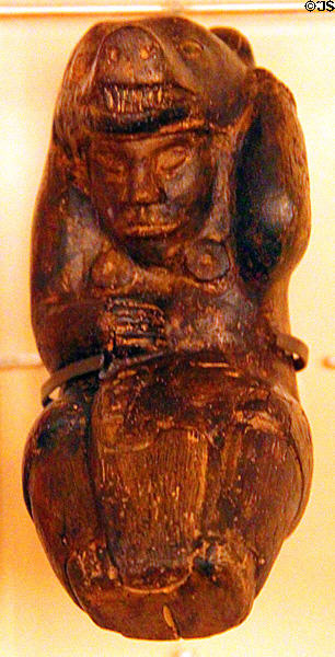 Prehistoric Indian stone carving of man in bear regalia at Newark Circle Mound. Newark, OH.