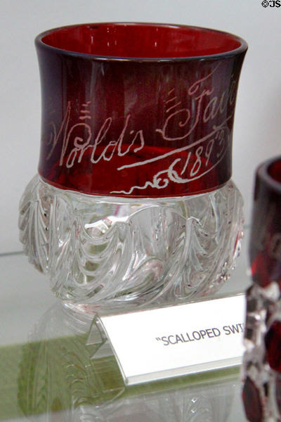 Columbian Exposition Ruby-stained souvenir glass in scalloped swirl pattern (1893) at Degenhart Paperweight & Glass Museum. Cambridge, OH.