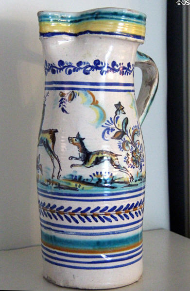 Ceramic pitcher with dog chasing deer & annular stripes at Kingscote. Newport, RI.