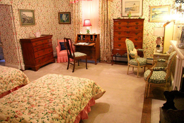 Bedroom with flowered wallpaper at Chepstow. Newport, RI.