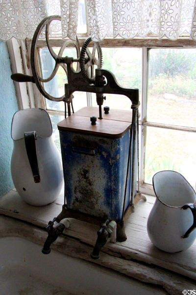 Butter churn & enameled pitchers in Fassel-Roeder House at Pioneer Museum. Fredericksburg, TX.