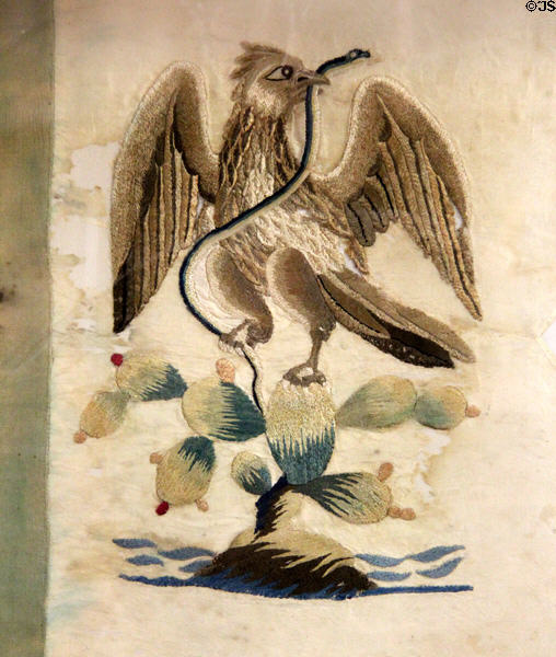 Detail of embroidered eagle with snake on Mexican flag captured at Battle of San Jacinto (April 21, 1836) at Dallas Historical Society Museum in Hall of State in Fair Park. Dallas, TX.