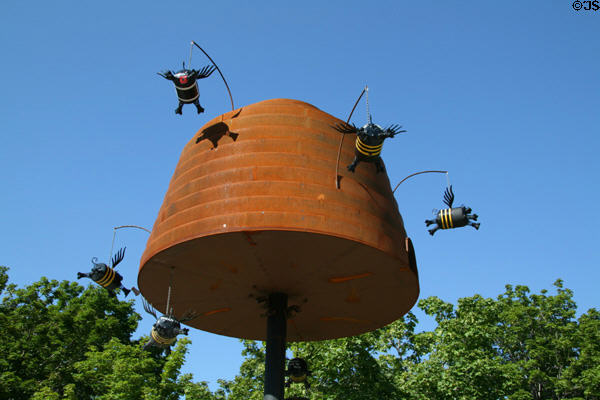 Flying Objects theme art of flying piglets with bee strips around beehive by Fred Conlon near Convention Center. Salt Lake City, UT.