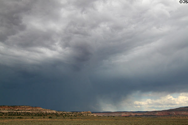 Landscape with rain in distance north of Monticello along Highway US191 south of Moab. UT.
