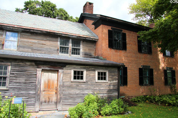 Brick farmhouse Variety Unit (c1835) (only building original to site) display ceramics, glass & other decorative arts at Shelburne Museum. Shelburne, VT.