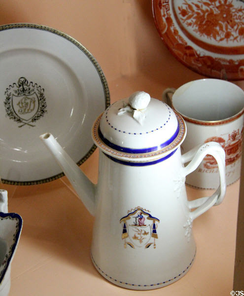 Chinese export porcelain chocolate pot with painted crest with symbol of hope at Shelburne Museum. Shelburne, VT.