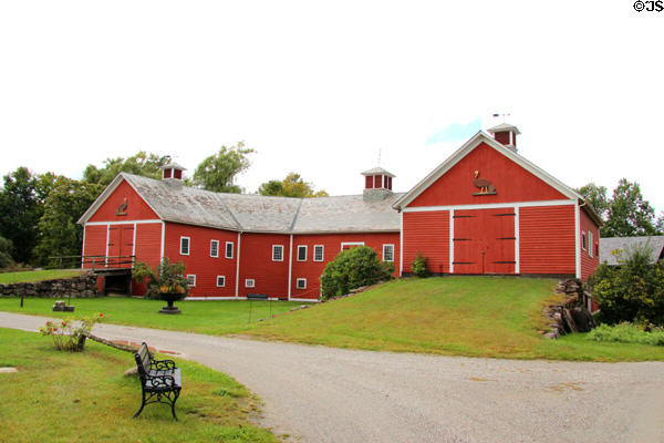 Horseshoe barn holds large collection of horse-drawn vehicles at Shelburne Museum. Shelburne, VT.