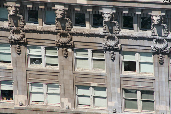 Row of lions along top floor of Hoge Building. Seattle, WA.