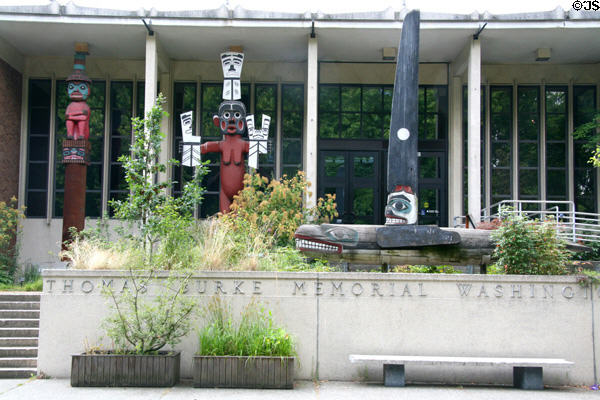 Northwest coast native totems outside Thomas Burke Museum of Natural History & Culture at University of Washington. Seattle, WA.