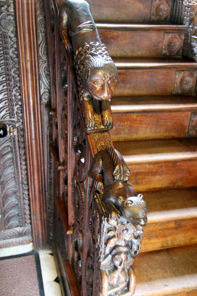 Staircase with animal carvings on railing at Plas Newydd. Llangollen, Wales.