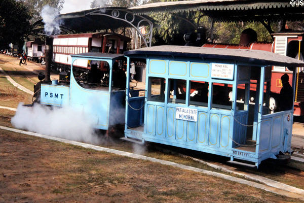 Blue steam monorail carries passengers around rail museum. Delhi, India.