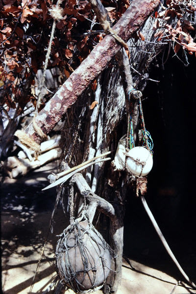 Variety of native tools & devices hang in craft village at Victoria Falls. Zimbabwe.