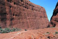 Massive size of The Olgas dwarfs two hikers. Australia.