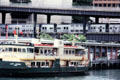 Sydney Ferries boat & commuter train on Sydney Harbour. Sydney, Australia.
