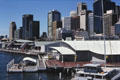 Smooth white roof of Sydney Aquarium in front of skyline. Sydney, Australia.