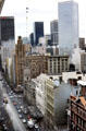 Heritage buildings along Collins St. with modern office towers beyond. Melbourne, Australia.