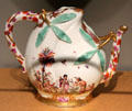 Meissen porcelain peach-shaped wine pot with applied leaves & imaginary painted Chinese scene at Gardiner Museum. Toronto, ON.