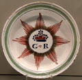 George I or II commemorated on English delftware dish prob. from Bristol at Gardiner Museum. Toronto, ON.