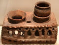 Etruscan clay portable stove with supports for two cooking pots at Royal Ontario Museum. Toronto, ON.