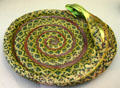 Faience bowl in shape of coiled bowl by Nikolaus Zsolnay of Pécs, Hungary at Ariana Museum. Geneva, Switzerland.