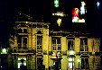 Insurance Building with Christmas decorations at night seen from Parque Morazán in San José. Costa Rica.