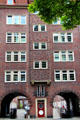 Entrance between archways to unit in brick building at Steinstraße & Mohlenhofstraße. Hamburg, Germany.