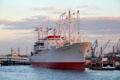 Profile of Museum Ship Cap San Diego, a German built cargo ship on Elbe River at dusk. Hamburg, Germany
