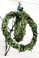 Historic wrought iron sign with maiden on wreath at Hamburg History Museum. Hamburg, Germany.