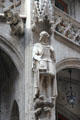 Sculpture of bearded figure in historic dress on Neues Rathaus. Munich, Germany.