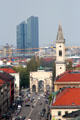 Victory gate by Eduard Mezger & St Ludwig church spire by Friedrich von Gärtner with highrises beyond north of city. Munich, Germany.