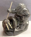 Carved soapstone hunter with walrus from Northern Canada at Five Continents Museum. Munich, Germany.