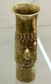 Inca culture gold beaker with face relief from southern coast of Peru at Five Continents Museum. Munich, Germany.