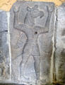 Assyrian relief of winged human body with bird head in transition between to more human form at Pergamon Museum. Berlin, Germany.