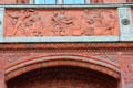 Food market frieze by Otto Geyer on balcony of Rotes Rathaus. Berlin, Germany.