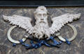 Winged face with scythes in Marienkirche. Stralsund, Germany.