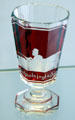 Stemmed two-colored goblet where red glass is cut away & etched to show picture of hunting scene at Schleswig Holstein State Museum. Schleswig, Germany.