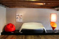 Modern 'Sacco' beanbag chair by Pierro Gatti, Cesare Paolini & Franco Teodore; plastic garden bench by Walter Papst; & Cone Chair by Verner Panton at Schleswig Holstein State Museum. Schleswig, Germany.