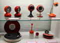 Metal table light fixtures, clocks, Philips 45rpm portable turntable, etc at Schleswig Holstein State Museum. Schleswig, Germany.