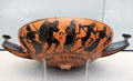 Etruscan terracotta black-figure knob handled cup with Dionysus & satyrs from Vulci in at Antikensammlungen. Munich, Germany.