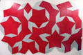 Roger Penrose non-periodic tiling using two different rhombi with equal length edges but with two particular angles at Deutsches Museum. Munich, Germany