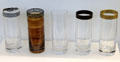 Drinking glasses with etched gold rims by Glashütte Valentin Eisch KG, of Frauenau at Deutsches Museum. Munich, Germany.