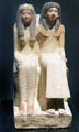 Seated figure of priest Neye & his mother Mutnofret of limestone from West Thebes at Museum Ägyptischer Kunst. Munich, Germany.
