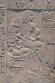 Tomb relief of deceased seated with his wife before offering table of limestone from Saqqara at Museum Ägyptischer Kunst. Munich, Germany.