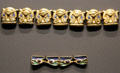 Chain links with head of Hathor & Eyes of Horus of gold & glass at Museum Ägyptischer Kunst. Munich, Germany.
